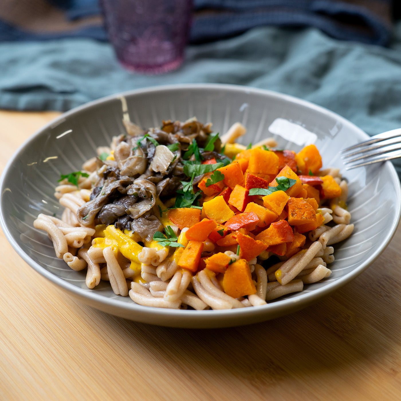 Wholegrain pasta in pumpkin sauce with mushrooms